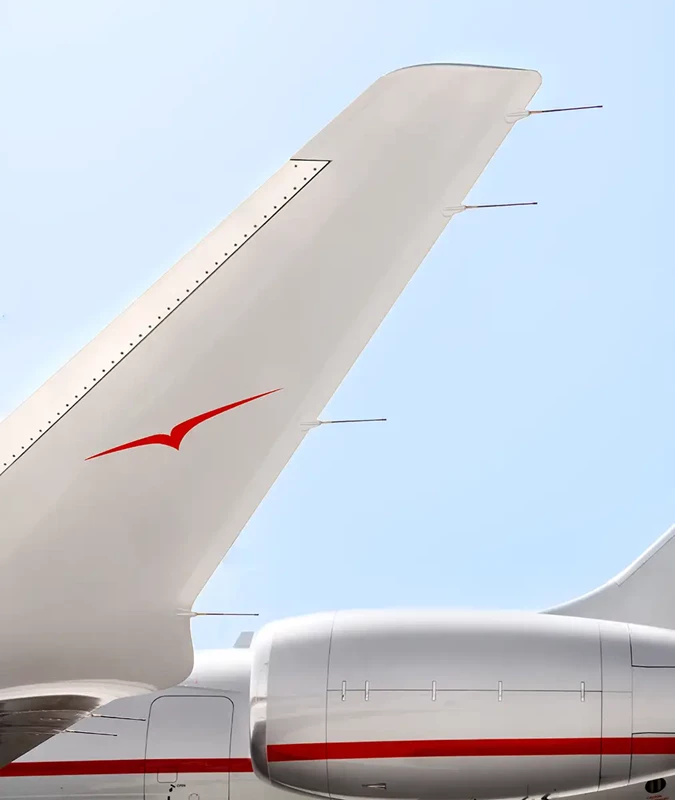 VistaJet Global 8000 silver and red private jet tail and engine