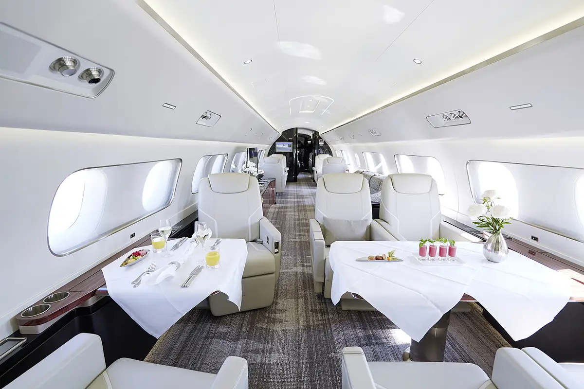 embraer lineage 1000e interior cabin being prepared for dinner