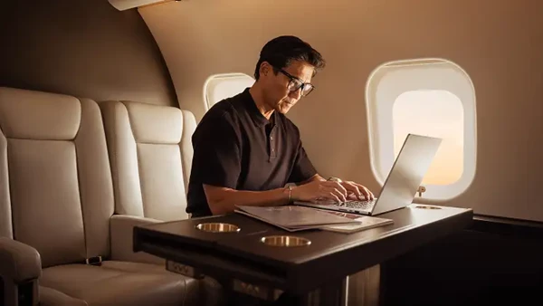 Man on laptop on a VistaJet